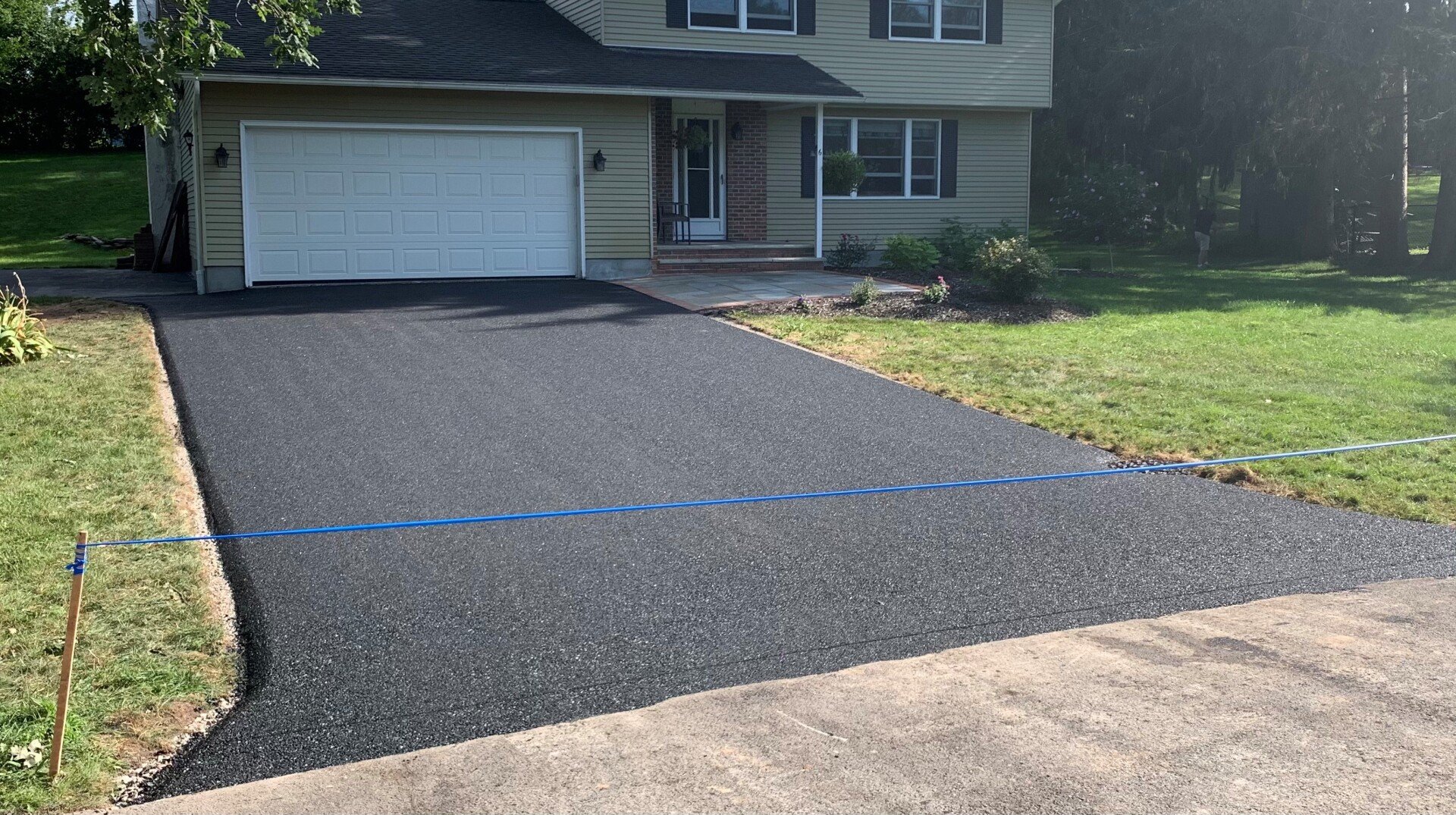New asphalt driveway installation